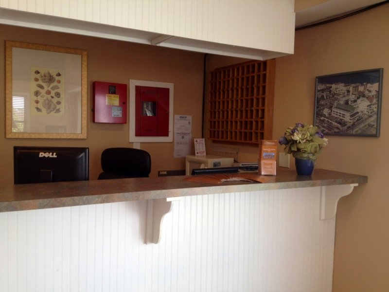 the front desk of a hotel lobby